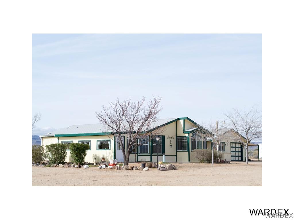 4117 Cove Road Golden Valley, AZ 86413 - Photo 1 of 32 a black white and white house with a outdoor space