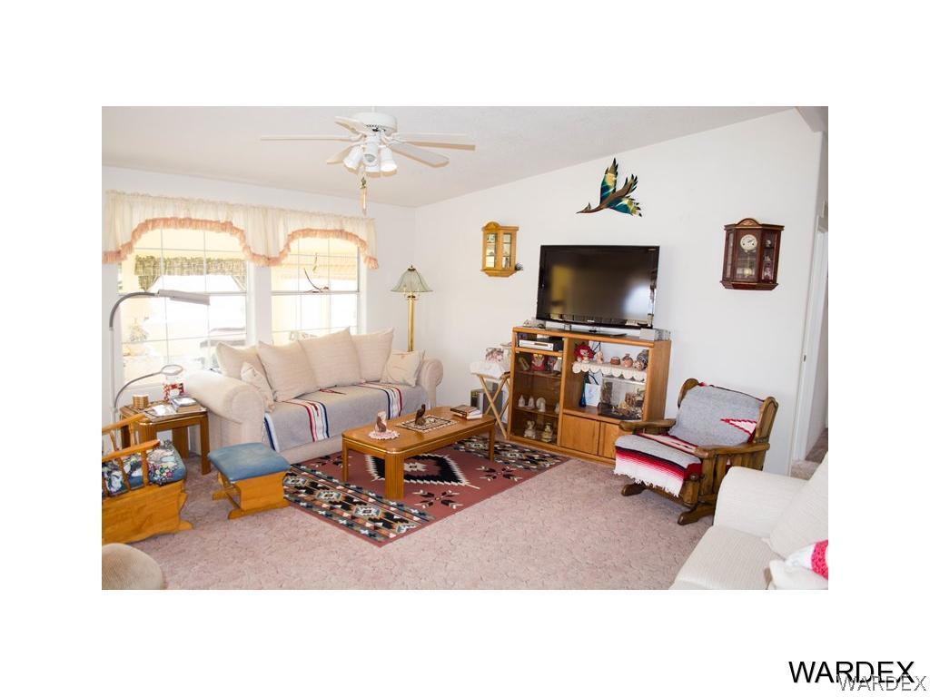 4117 Cove Road Golden Valley, AZ 86413 - Photo 11 of 32 a living room with furniture and a flat screen tv