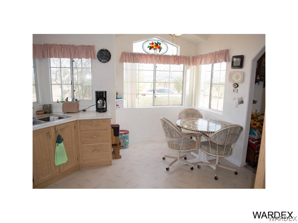 4117 Cove Road Golden Valley, AZ 86413 - Photo 16 of 32 a living room with furniture and a large window