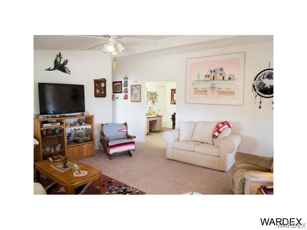 4117 Cove Road Golden Valley, AZ 86413 - Photo 24 of 32 a living room with furniture and a flat screen tv
