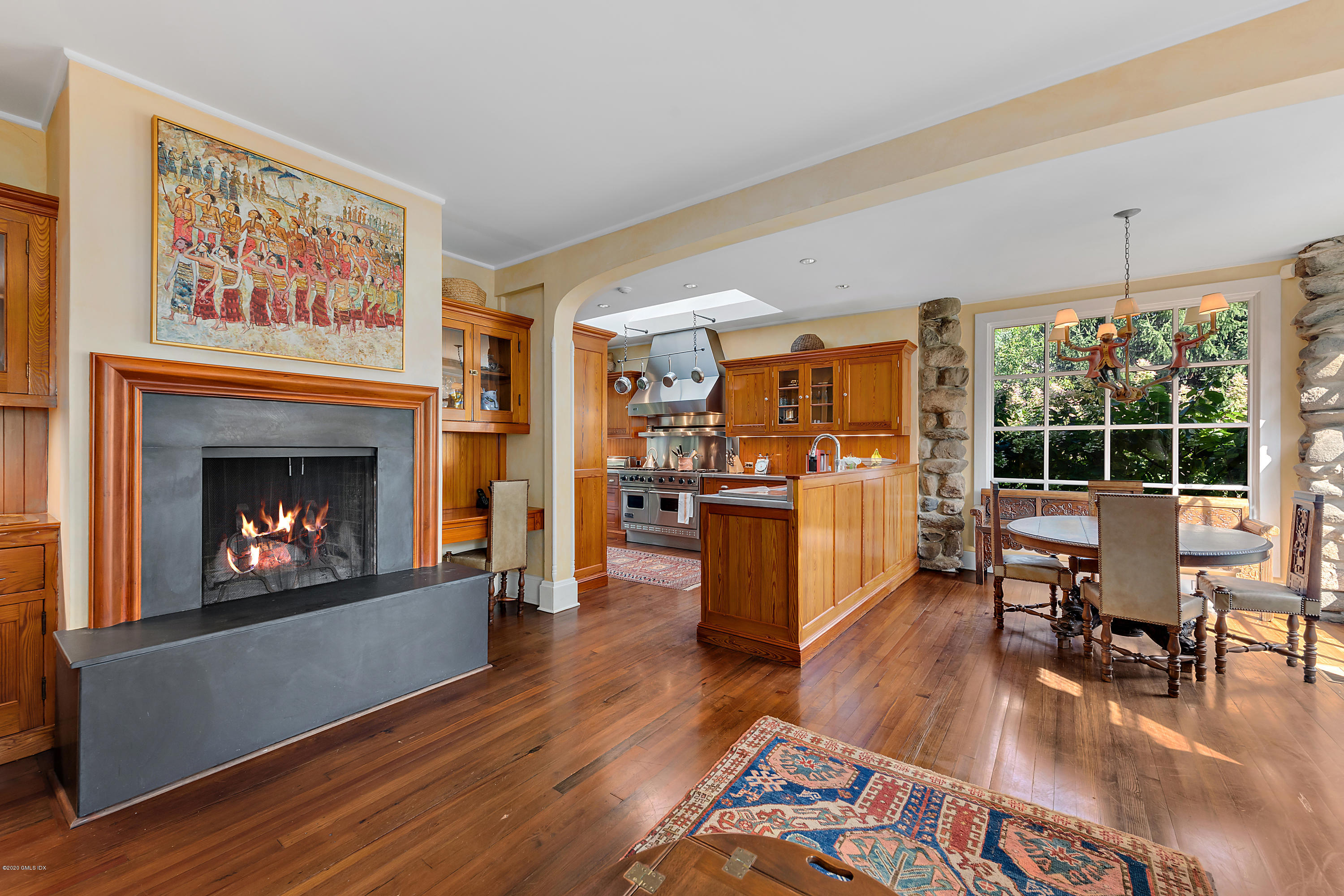 3 Fairfield Road Greenwich, CT 06830 - Photo 16 of 46 a living room with furniture wooden floor and a fireplace
