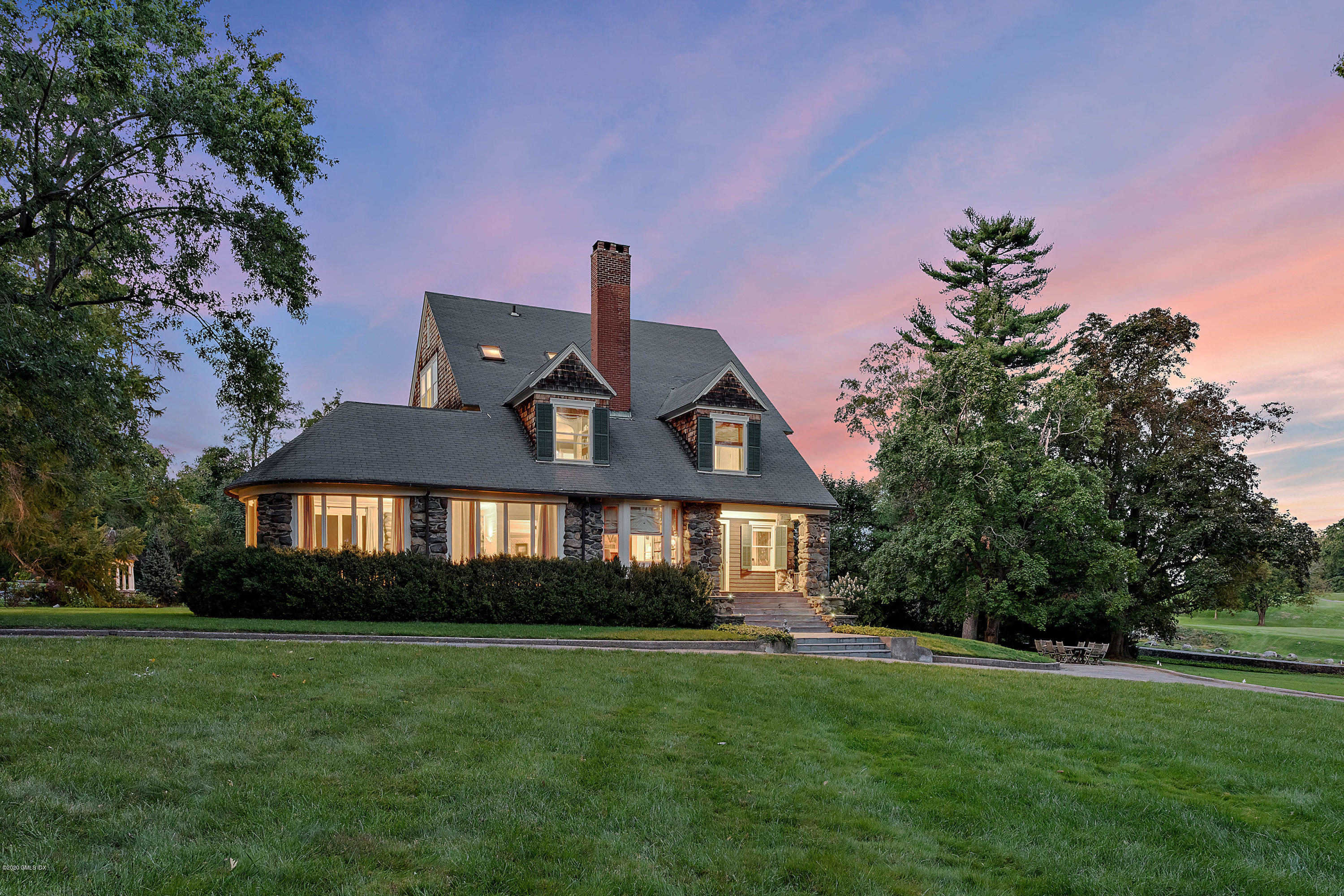 3 Fairfield Road Greenwich, CT 06830 - Photo 2 of 46 a front view of a house with a garden