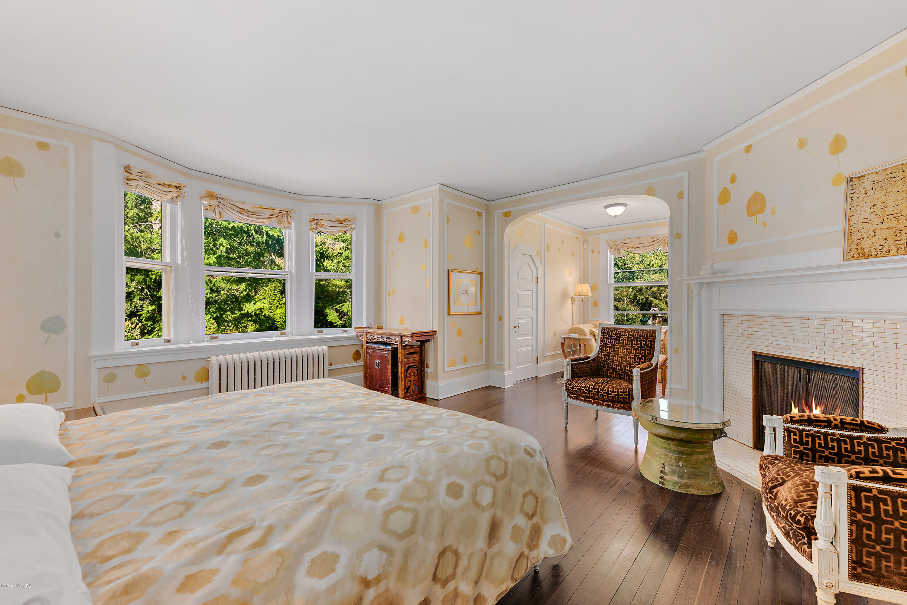 3 Fairfield Road Greenwich, CT 06830 - Photo 23 of 46 a spacious bedroom with a large bed and a fireplace