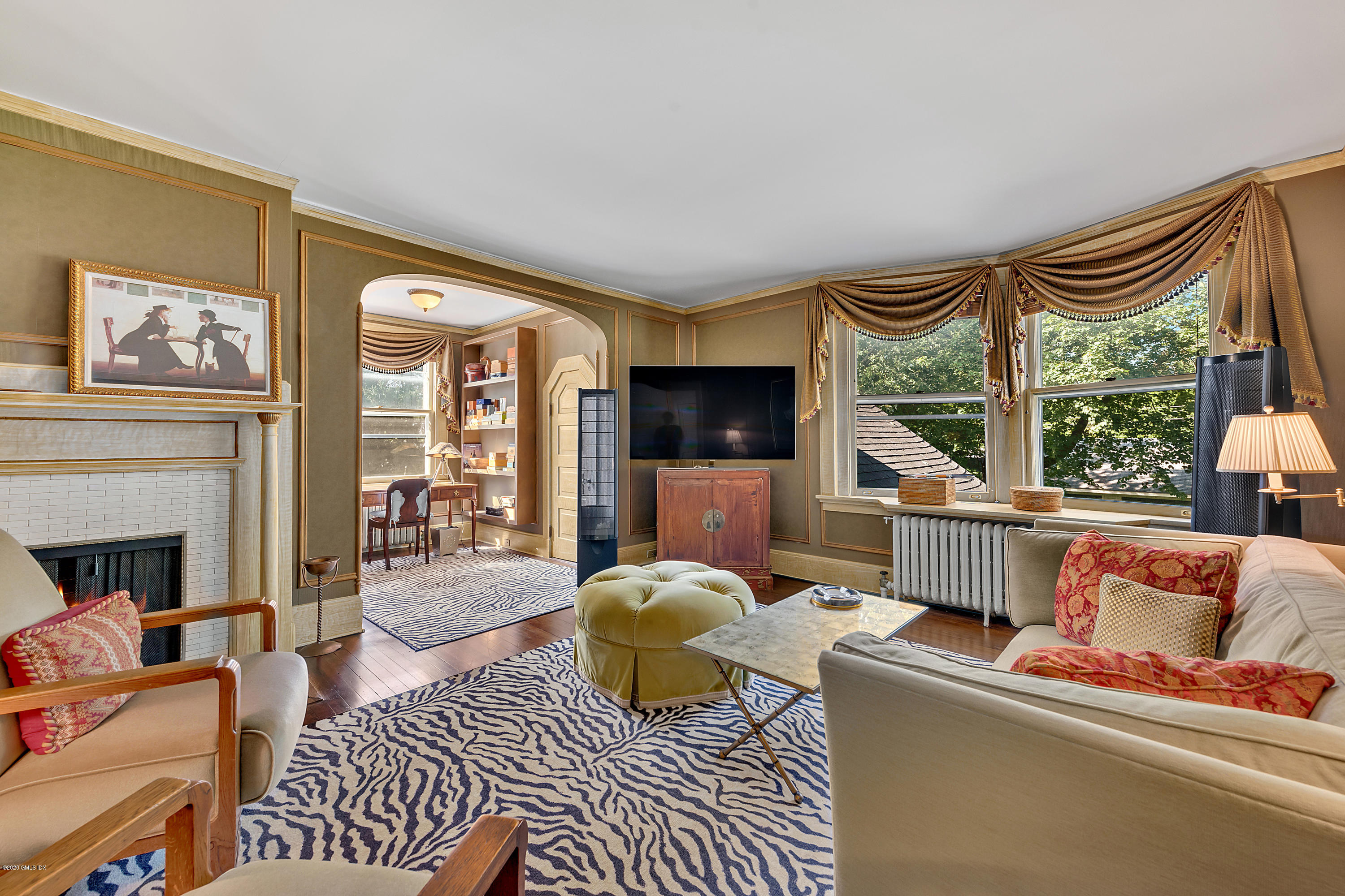 3 Fairfield Road Greenwich, CT 06830 - Photo 25 of 46 a living room with furniture a flat screen tv and a fireplace