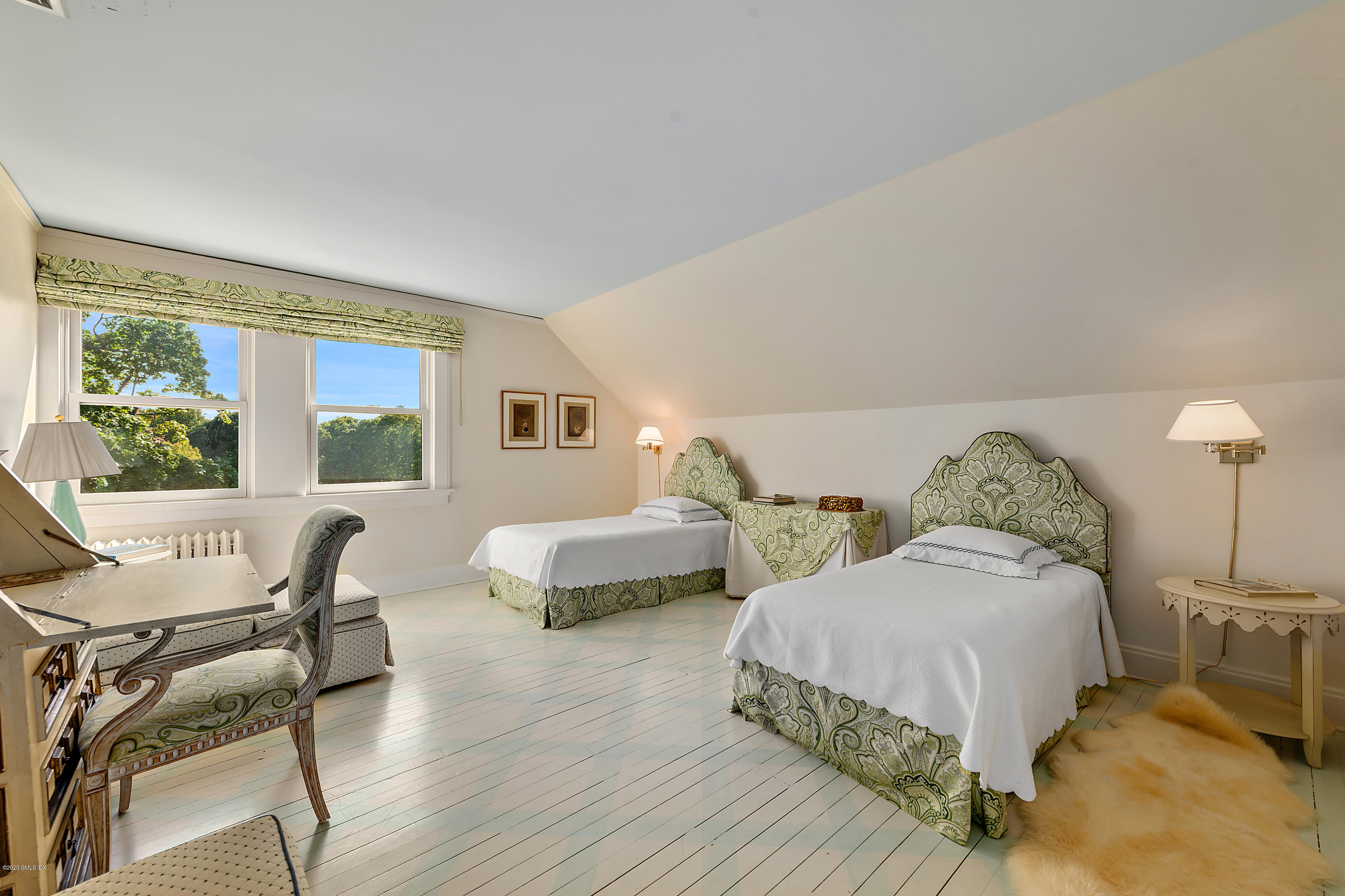 3 Fairfield Road Greenwich, CT 06830 - Photo 27 of 46 a spacious bedroom with two beds and a table