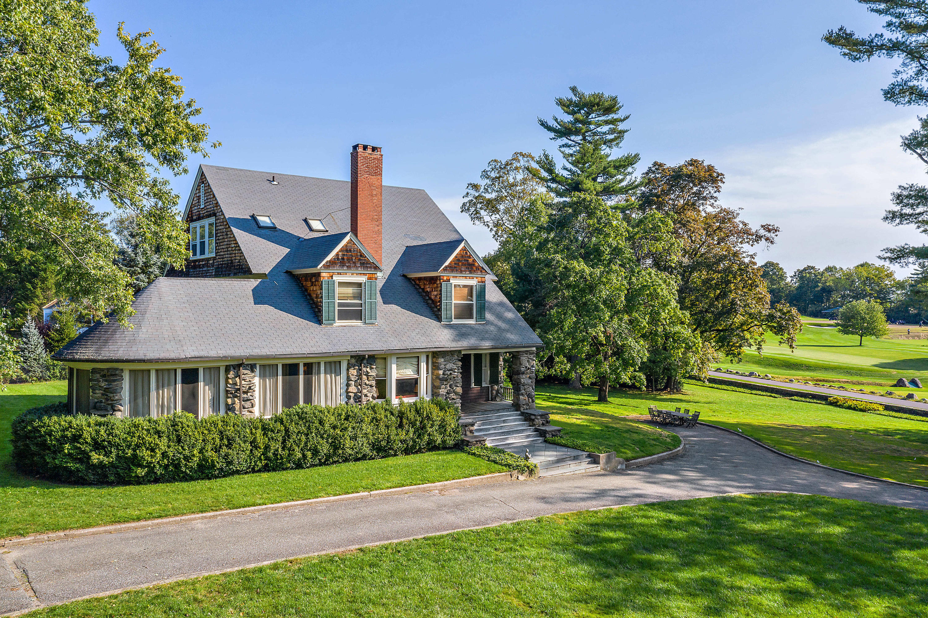 3 Fairfield Road Greenwich, CT 06830 - Photo 3 of 46 a front view of a house with a yard