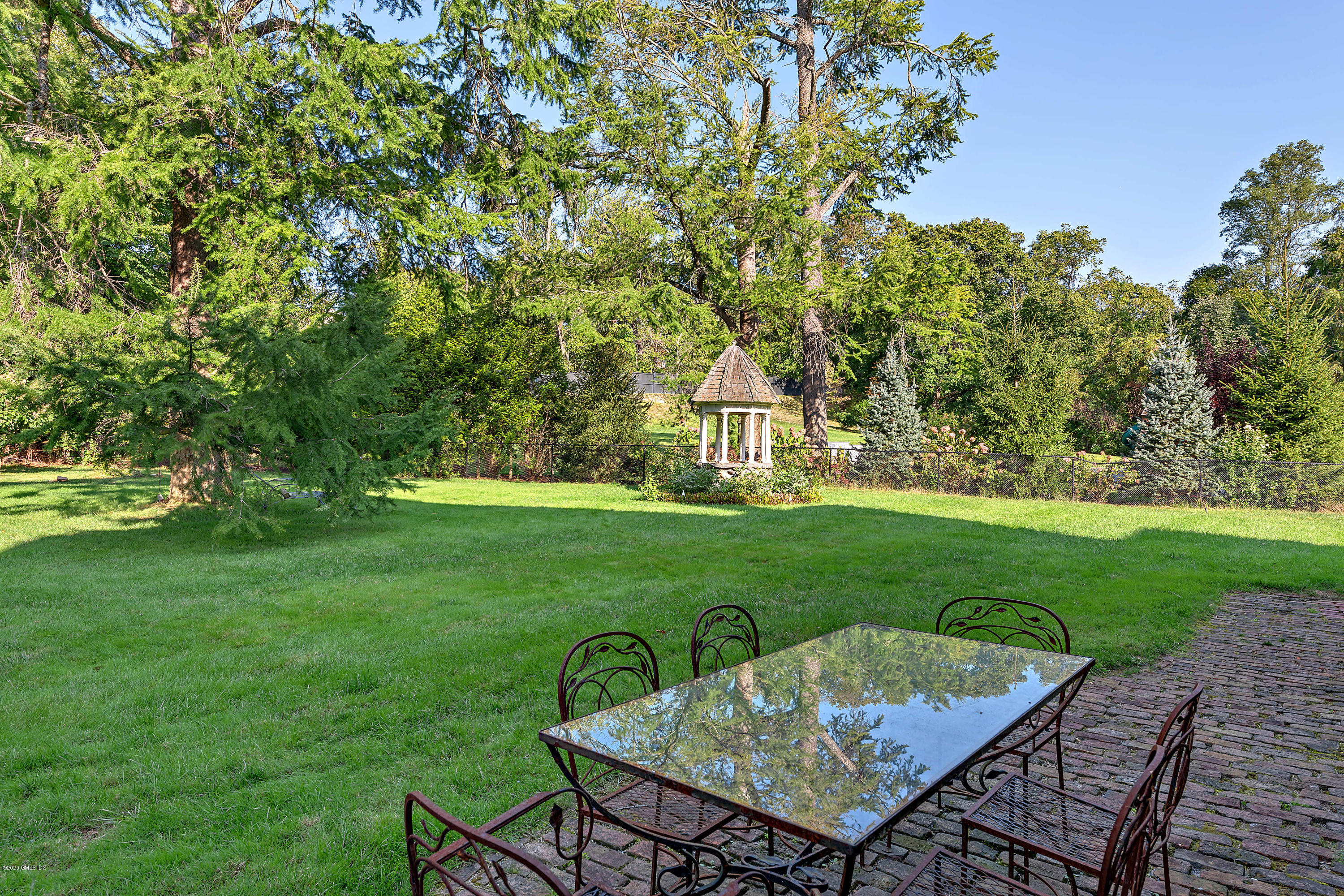 3 Fairfield Road Greenwich, CT 06830 - Photo 33 of 46 a view of a backyard with sitting area