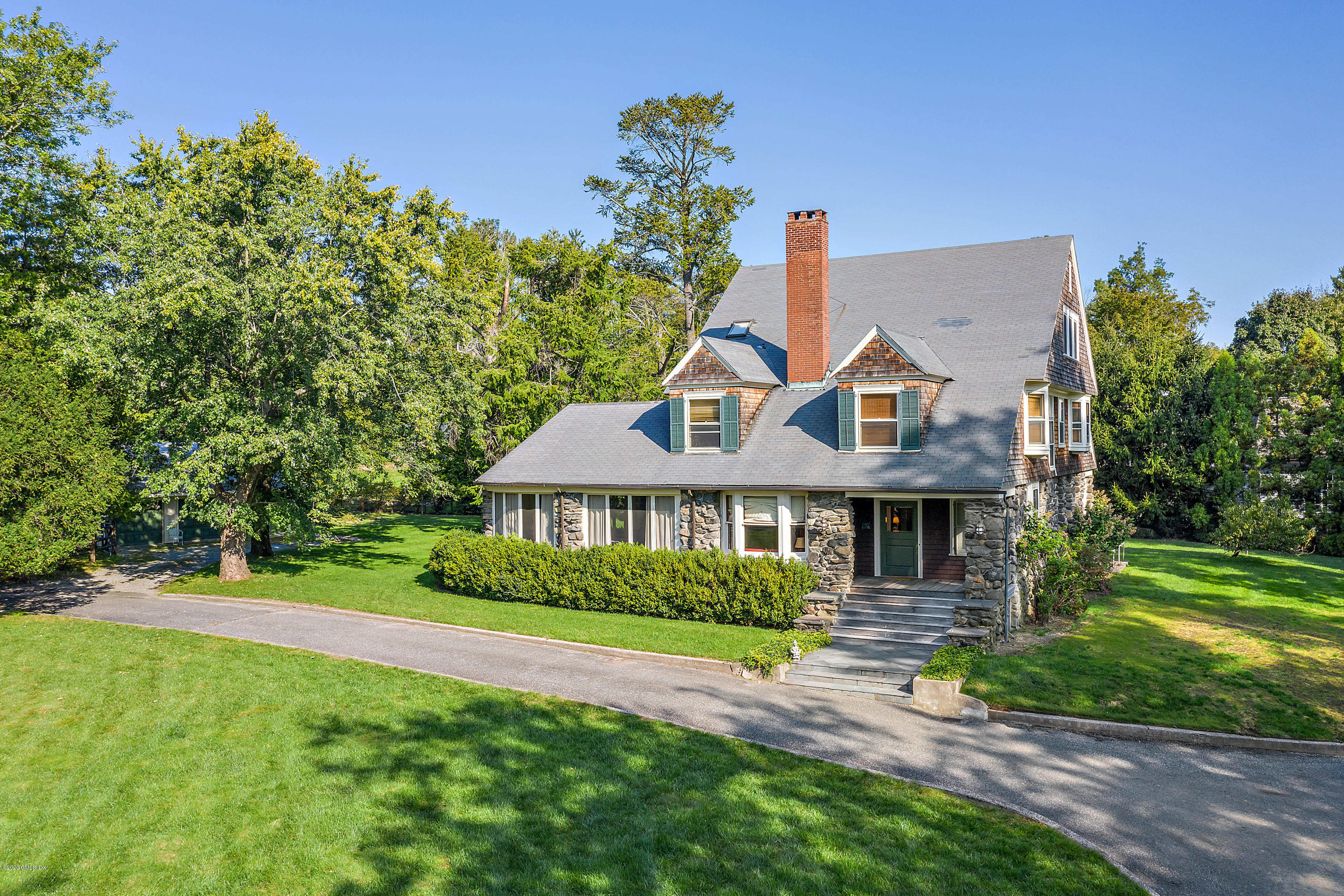 3 Fairfield Road Greenwich, CT 06830 - Photo 36 of 46 a front view of a house with a garden