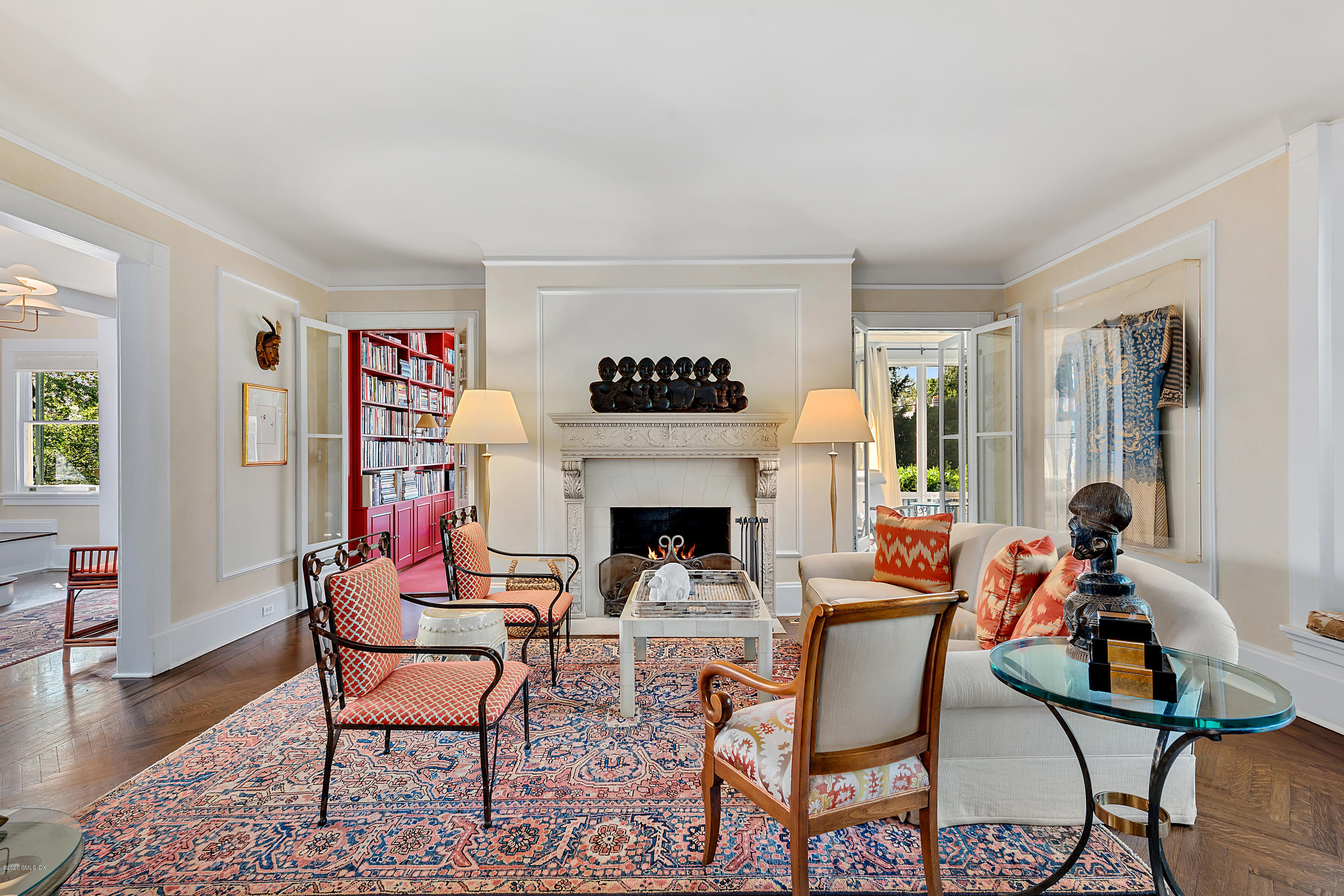 3 Fairfield Road Greenwich, CT 06830 - Photo 8 of 46 a living room with furniture a fireplace and a table