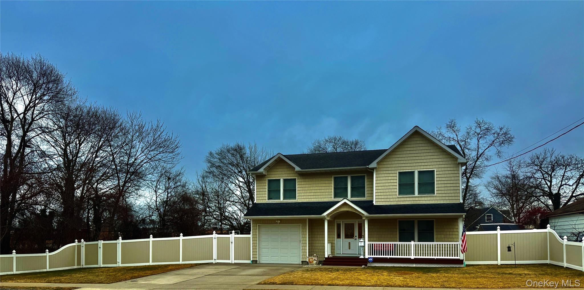 285 Daniel Street Lindenhurst, NY 11757 - Photo 2 of 15 a front view of a house with a yard