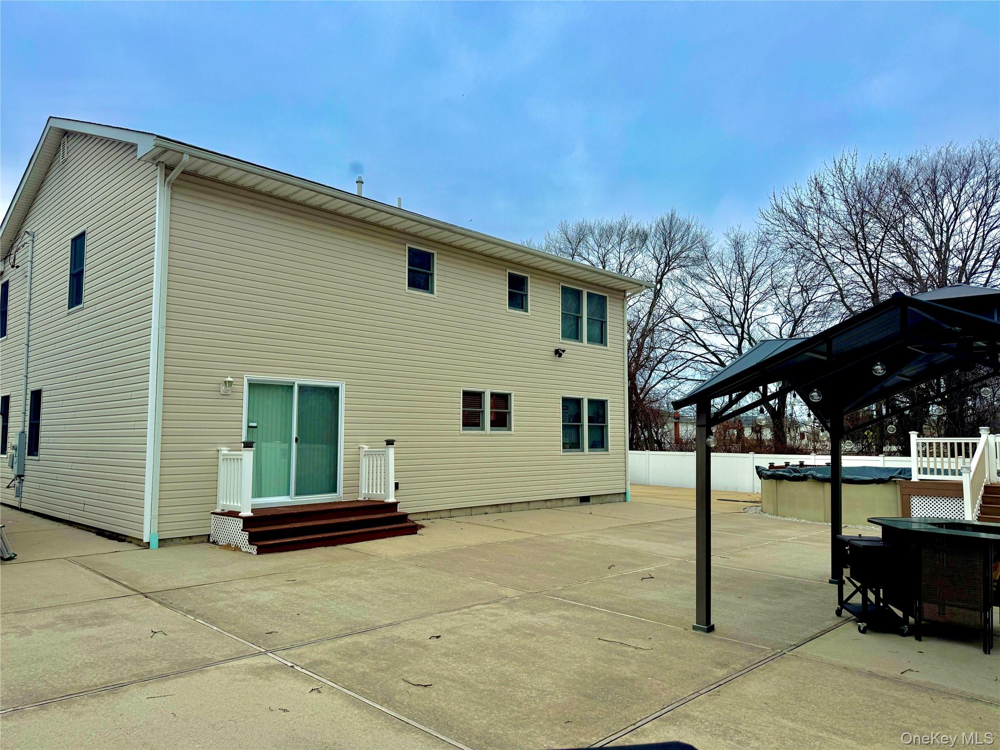 285 Daniel Street Lindenhurst, NY 11757 - Photo 6 of 15 a house view with a backyard space
