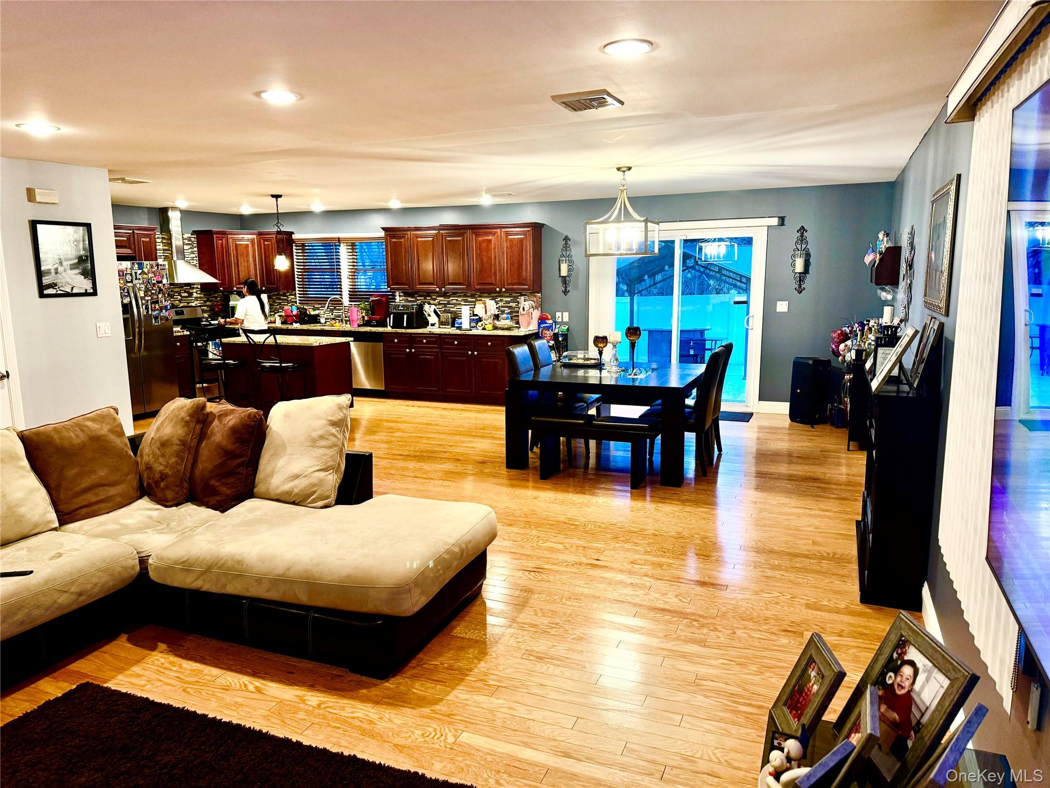 285 Daniel Street Lindenhurst, NY 11757 - Photo 7 of 15 a living room with furniture and view of kitchen