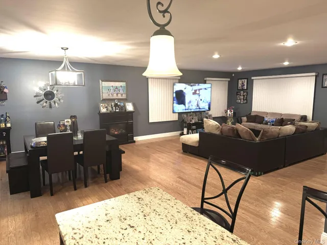 a large kitchen with a table and chairs