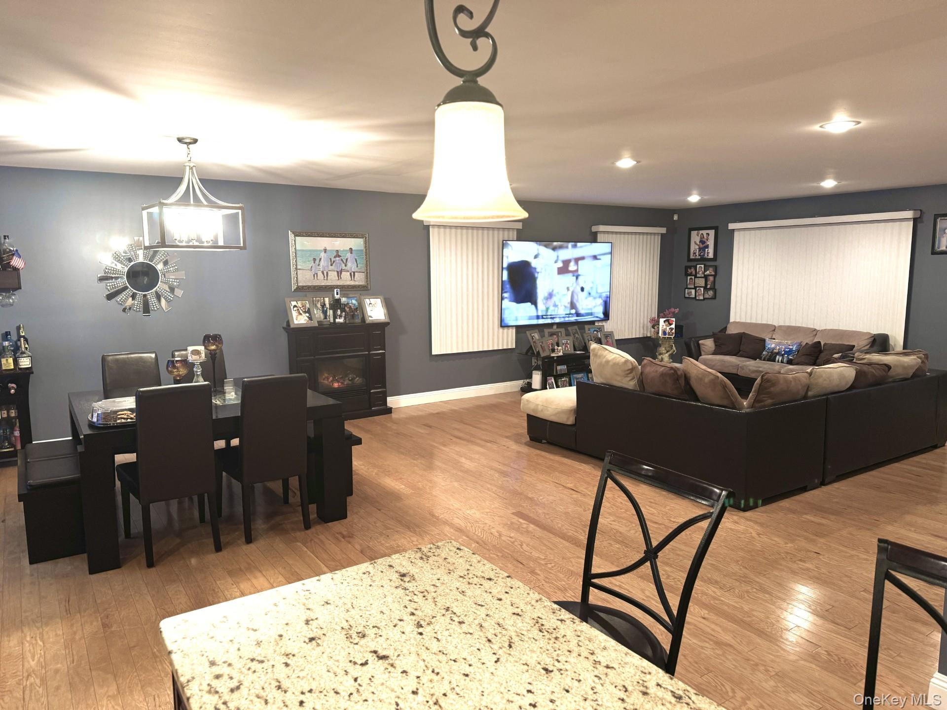 285 Daniel Street Lindenhurst, NY 11757 - Photo 10 of 15 a living room with furniture a window and a chandelier