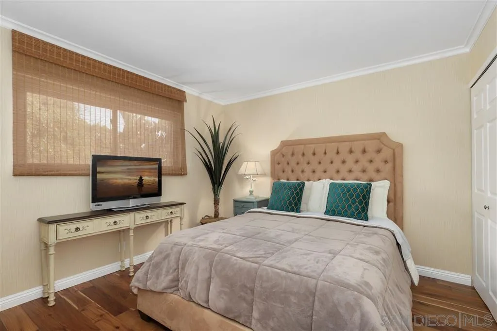 864 E Avenue Coronado, CA 92118 - Photo 14 of 20 a bedroom with a large bed and a flat screen tv