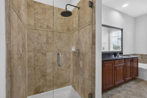 a bathroom with a bathtub and shower