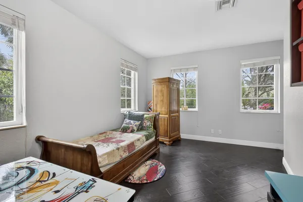 a view of a livingroom with a ceiling fan and window
