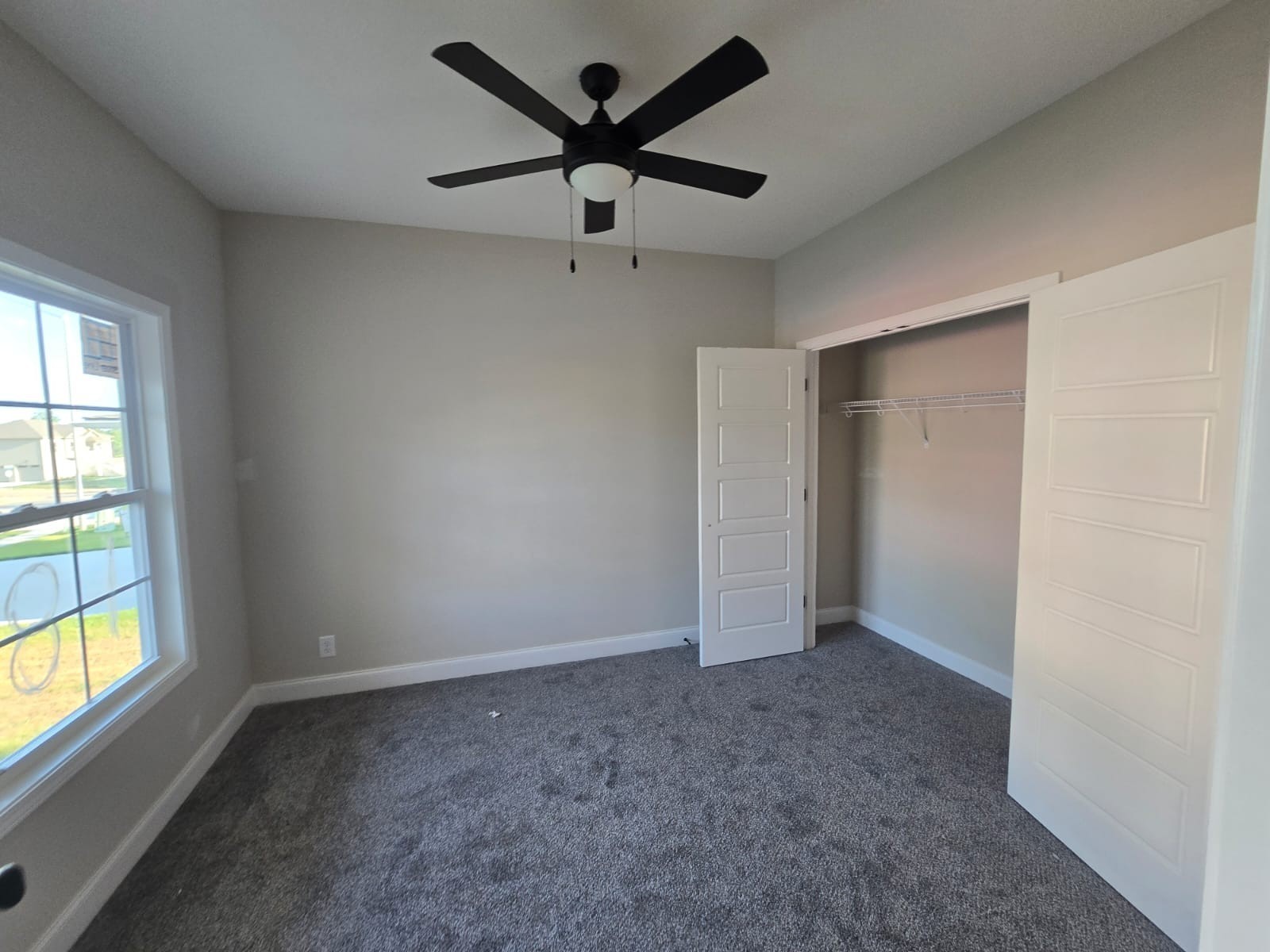 522 North Halifax Court Clarksville, TN 37040 - Photo 2 of 20 an empty room with a window and a fan