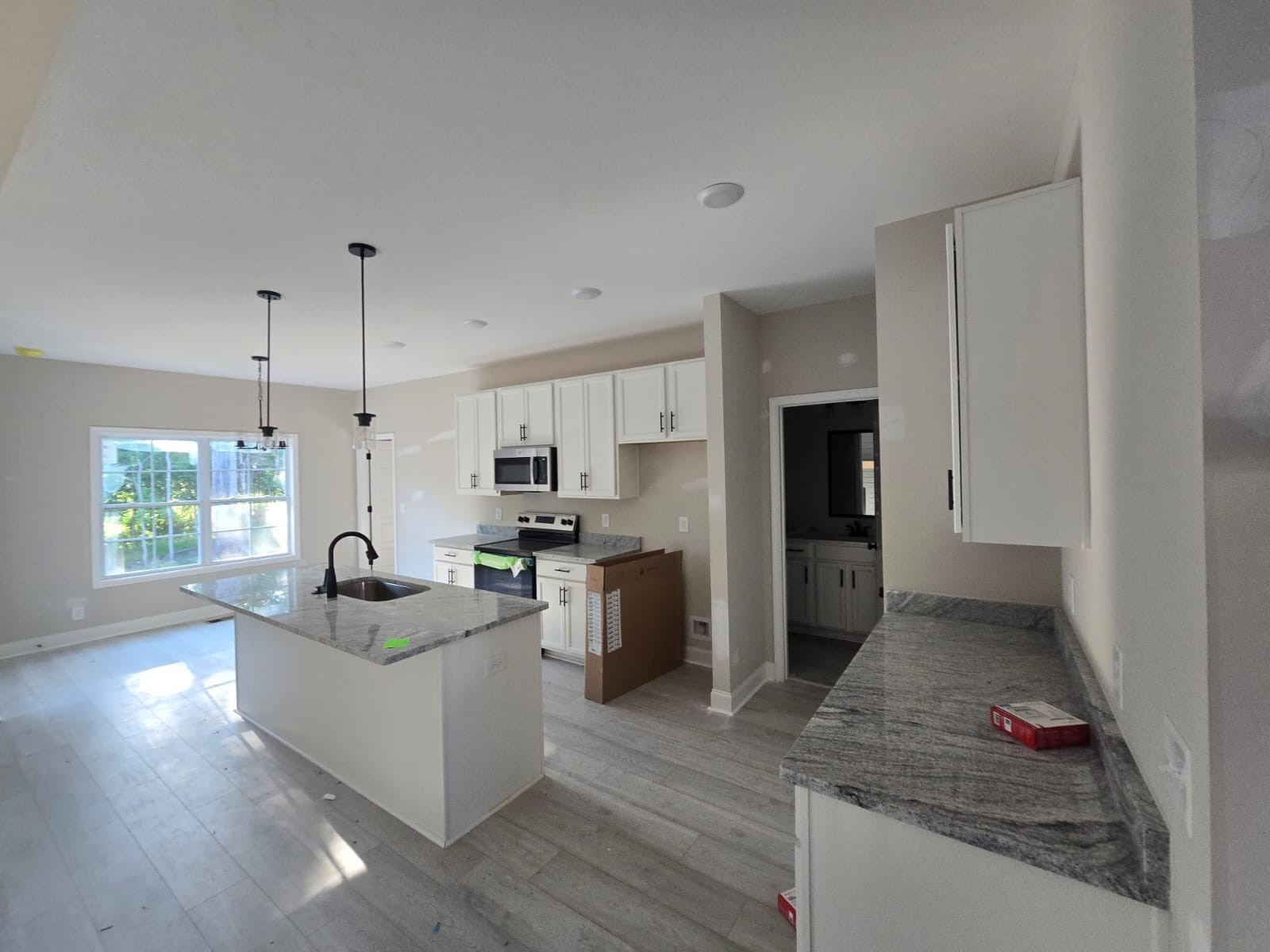 522 North Halifax Court Clarksville, TN 37040 - Photo 4 of 20 a kitchen with kitchen island white cabinets and stainless steel appliances