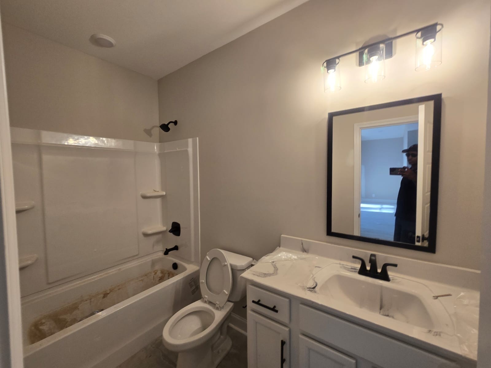 522 North Halifax Court Clarksville, TN 37040 - Photo 6 of 20 a bathroom with a granite countertop sink a toilet a mirror a bathtub and shower