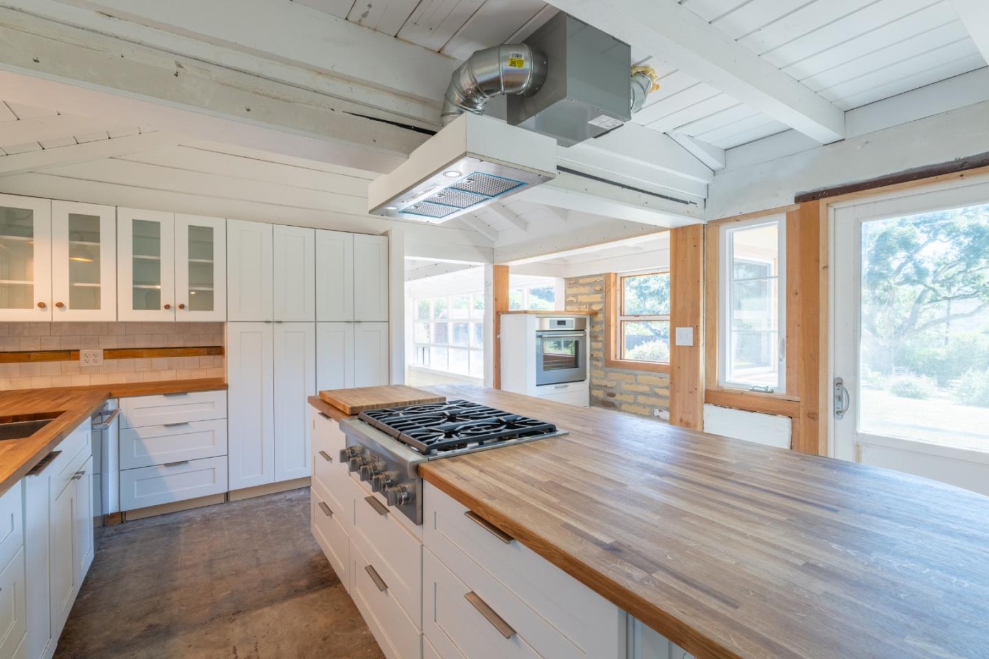 72 Los Laureles Grade Road Carmel Valley, CA 93924 - Photo 11 of 43 a kitchen with granite countertop a stove and a sink