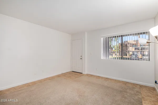 a view of an empty room with a window