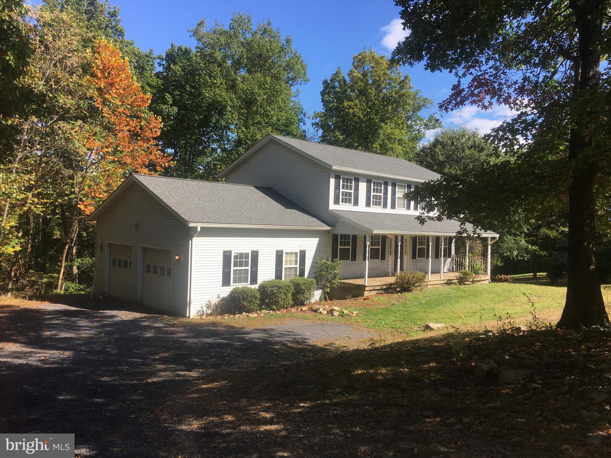 1401 Hillandale Road Front Royal, VA 22630 - Photo 2 of 2 a front view of a house with a garden