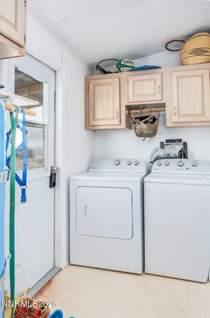 a utility room with closet dryer and washer