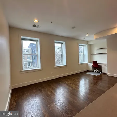 a view of livingroom with hardwood floor and window