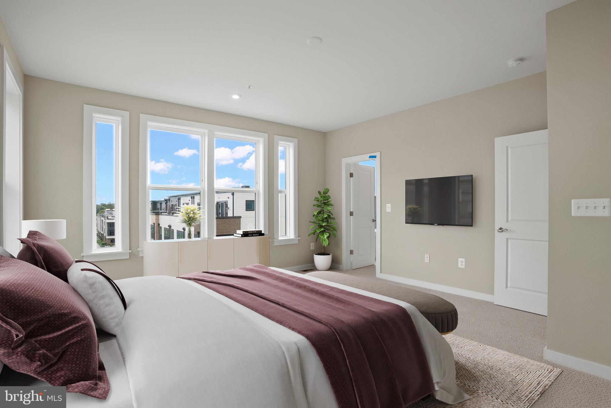 6713 Belcrest Road Hyattsville, MD 20782 - Photo 16 of 29 a bedroom with a bed and a large window
