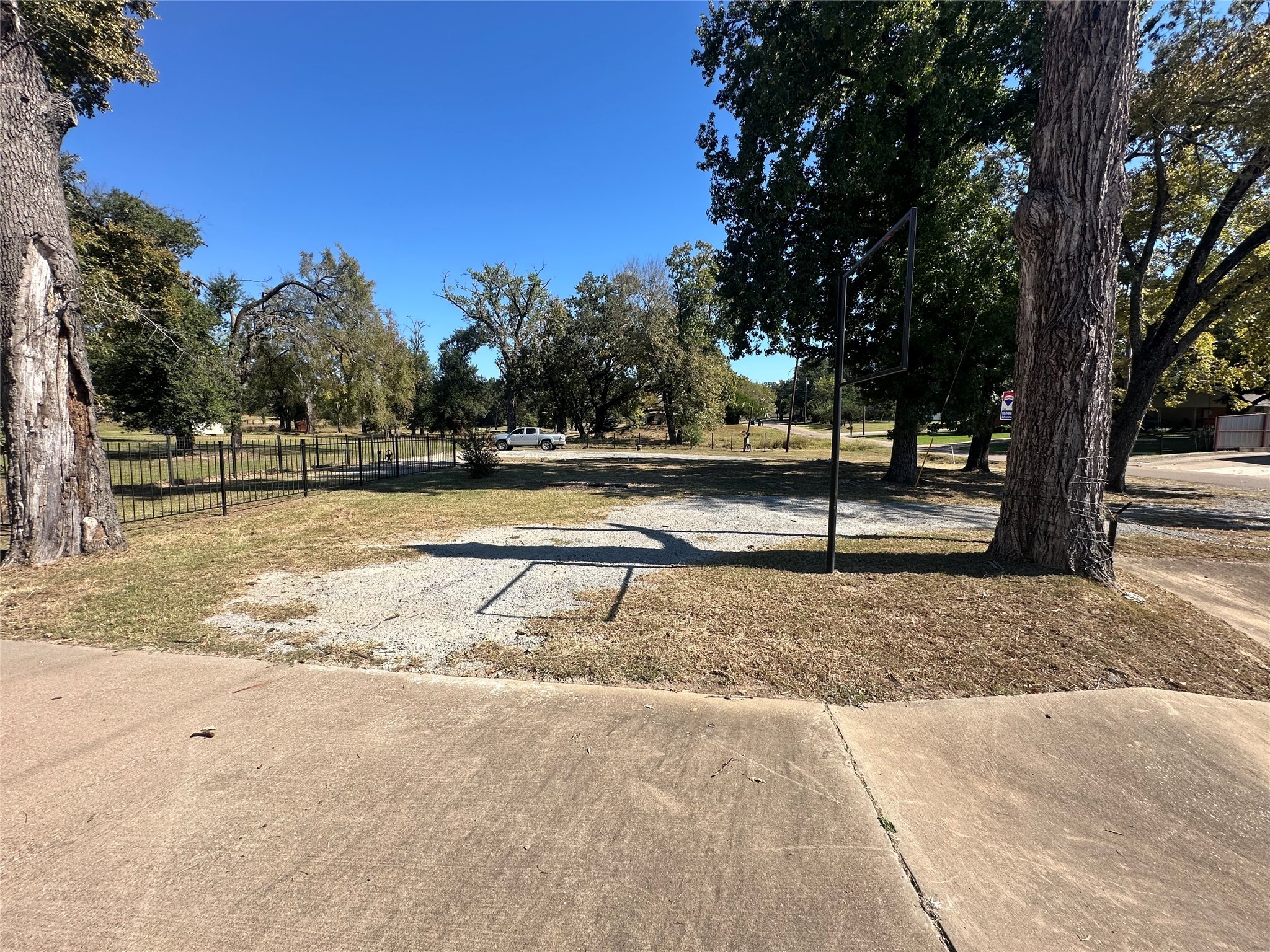 1042 West Commerce Street Buffalo, TX 75831 - Photo 8 of 16 a view of yard with wooden fence and trees