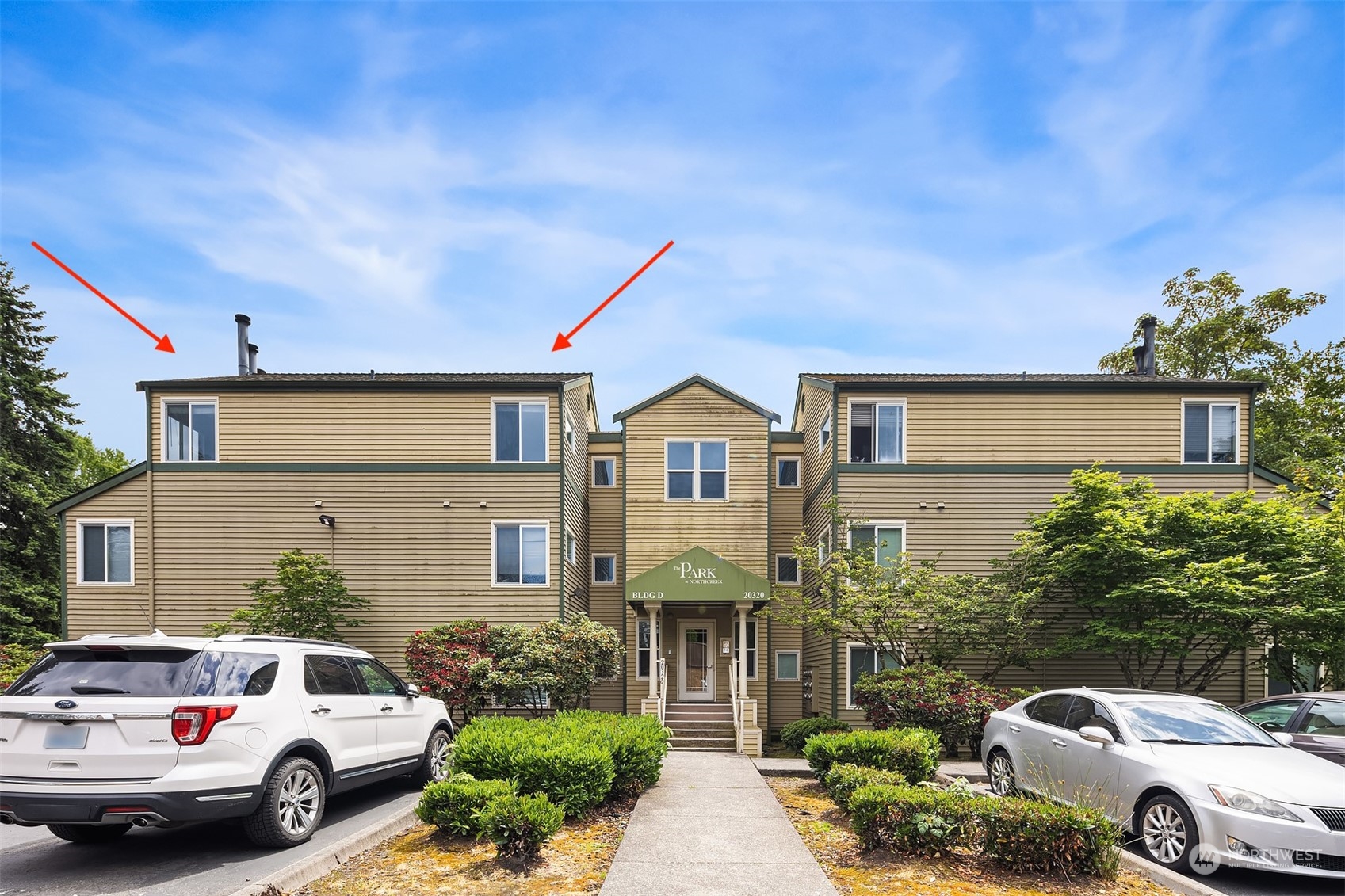 20320 Bothell Everett Highway, Unit D304 Bothell, WA 98012 - Photo 1 of 21 a front view of a house with a garden