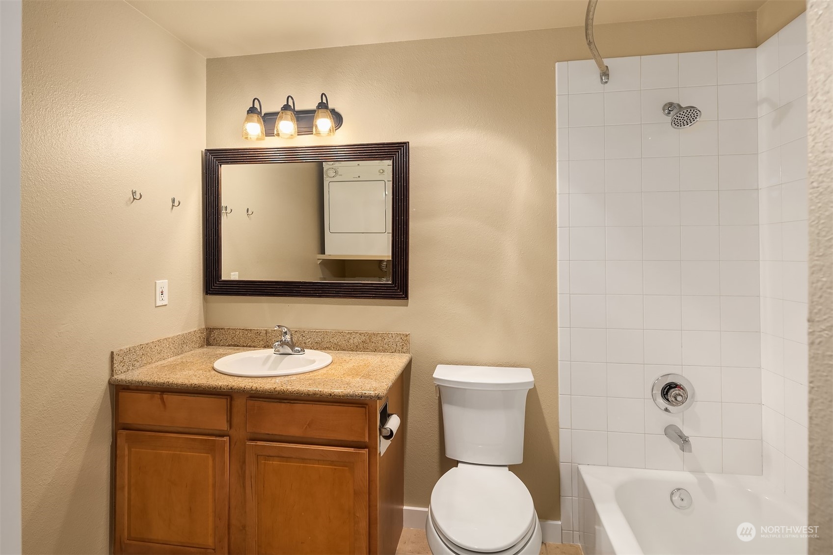 20320 Bothell Everett Highway, Unit D304 Bothell, WA 98012 - Photo 11 of 21 a bathroom with a sink toilet and shower