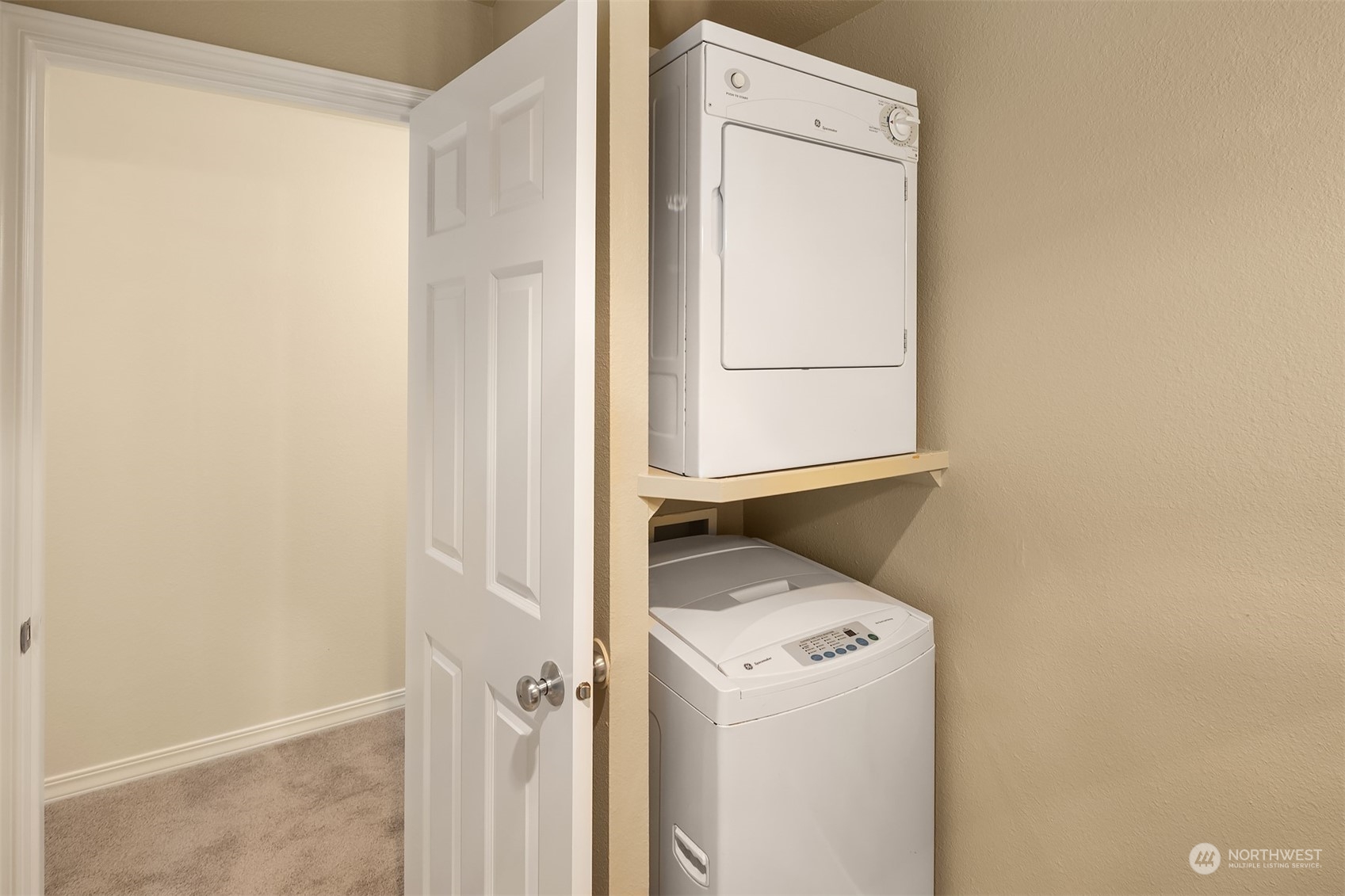 20320 Bothell Everett Highway, Unit D304 Bothell, WA 98012 - Photo 12 of 21 a utility room with dryer and washer