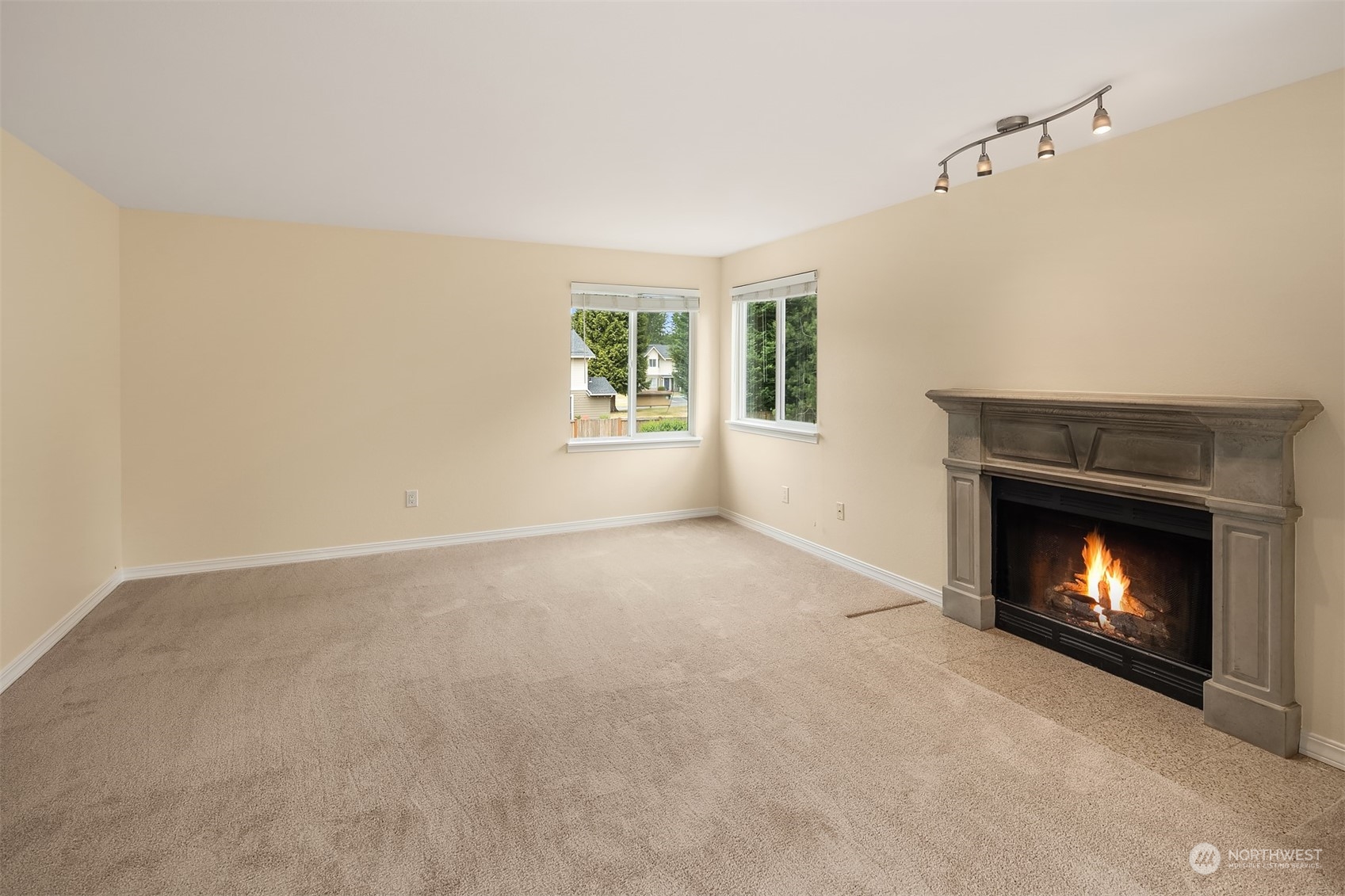 20320 Bothell Everett Highway, Unit D304 Bothell, WA 98012 - Photo 7 of 21 a view of an empty room with a fireplace