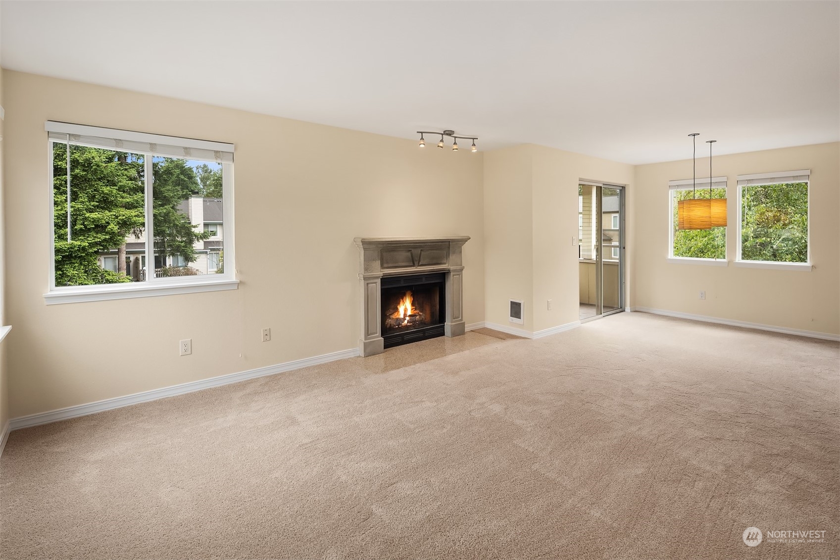20320 Bothell Everett Highway, Unit D304 Bothell, WA 98012 - Photo 8 of 21 an empty room with windows and fireplace