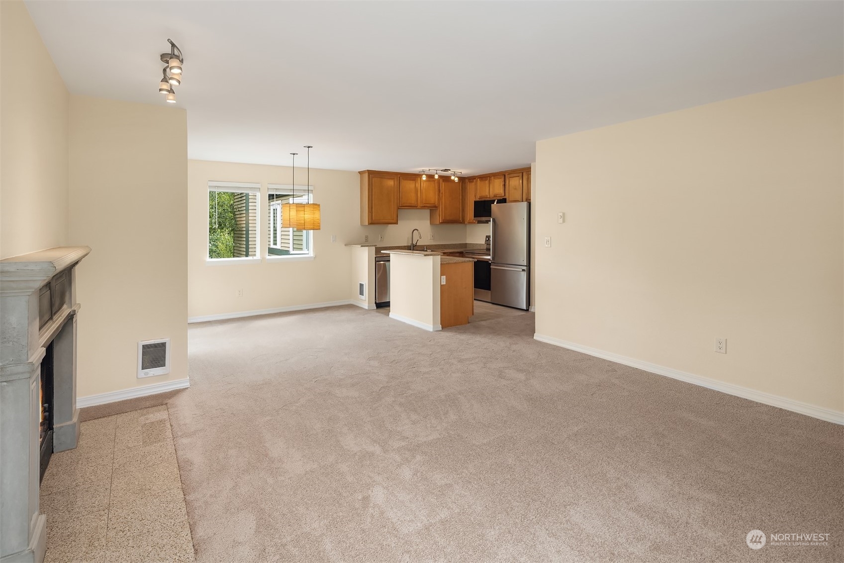 20320 Bothell Everett Highway, Unit D304 Bothell, WA 98012 - Photo 9 of 21 a view of a kitchen with a sink and a refrigerator