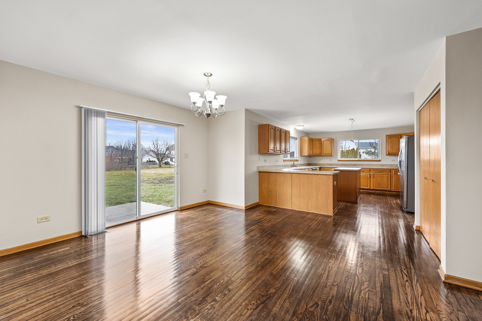 25210 Plainview Drive Channahon, IL 60410 - Photo 11 of 33 a view of a kitchen with wooden floor and a kitchen
