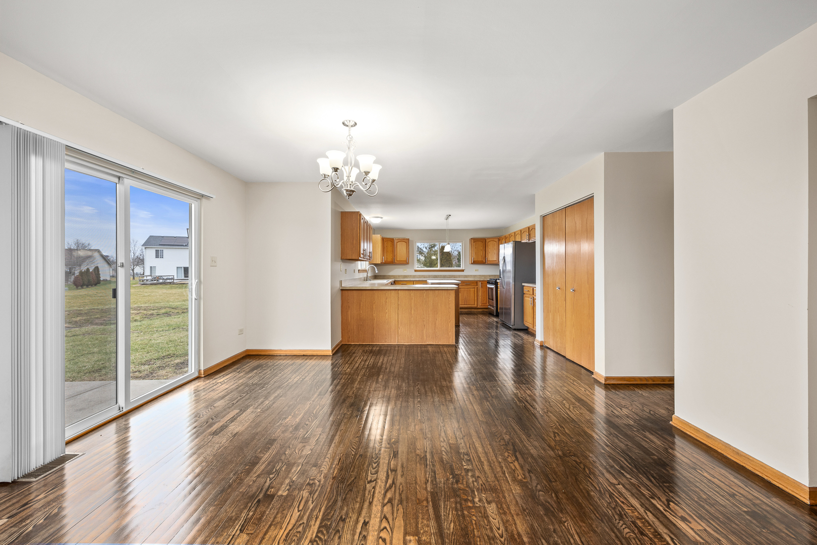25210 Plainview Drive Channahon, IL 60410 - Photo 12 of 33 a view of a kitchen with wooden floor and a kitchen