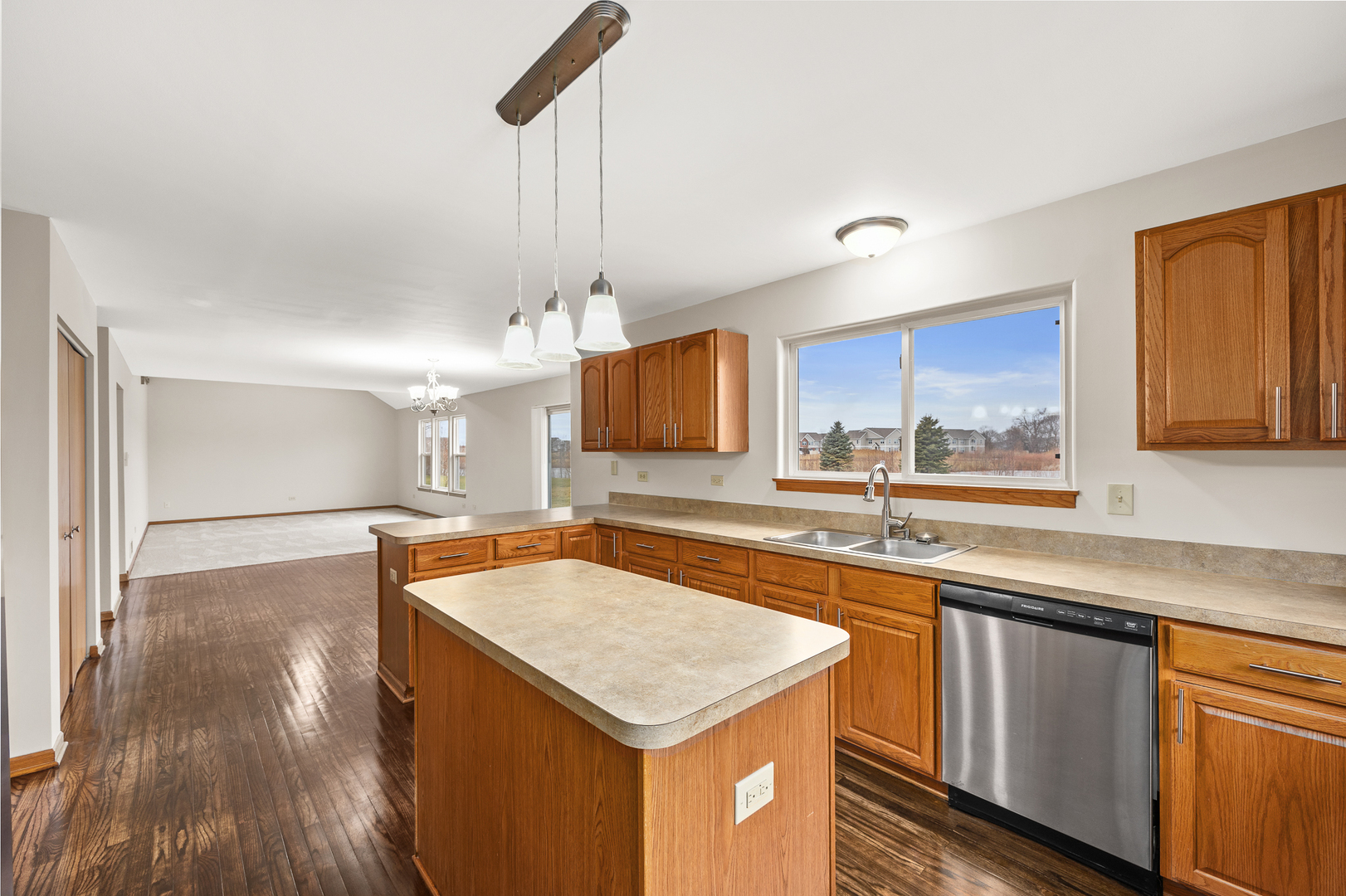 25210 Plainview Drive Channahon, IL 60410 - Photo 8 of 33 a kitchen with stainless steel appliances granite countertop a sink a stove and a wooden floors