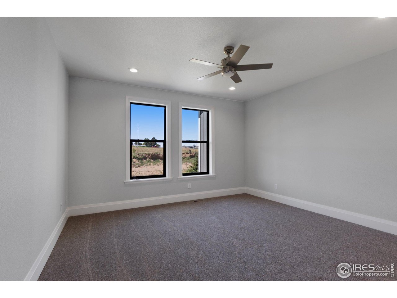 5700 2nd Road Greeley, CO 80634 - Photo 19 of 40 The spacious primary suite, all bedrooms have deluxe, high pile carpeting