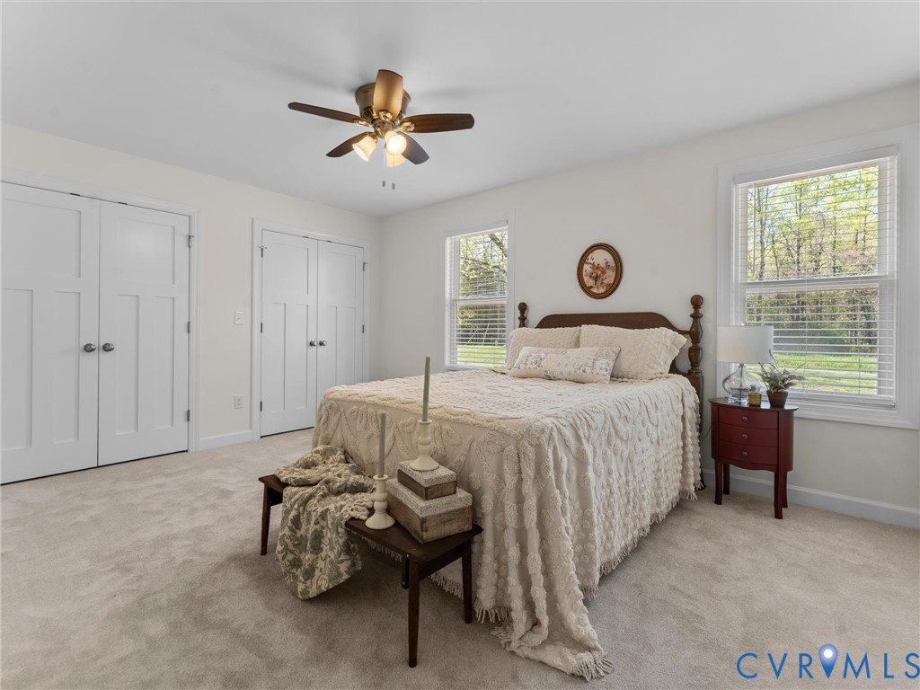 143 High School Road Buckingham, VA 23921 - Photo 30 of 50 a bedroom with a bed and a chandelier