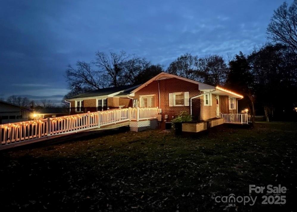 a view of an house with backyard space and garden