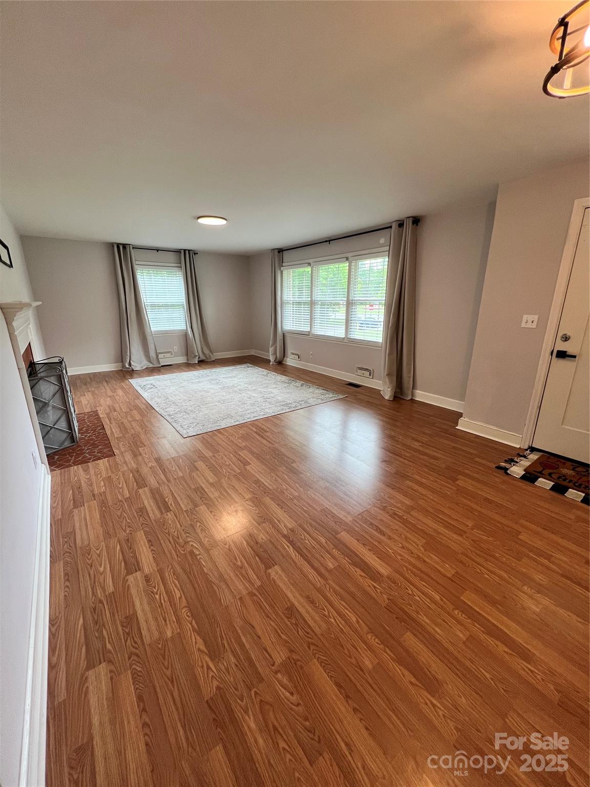 800 Charles Road Shelby, NC 28152 - Photo 11 of 21 wooden floor in an empty room with a window
