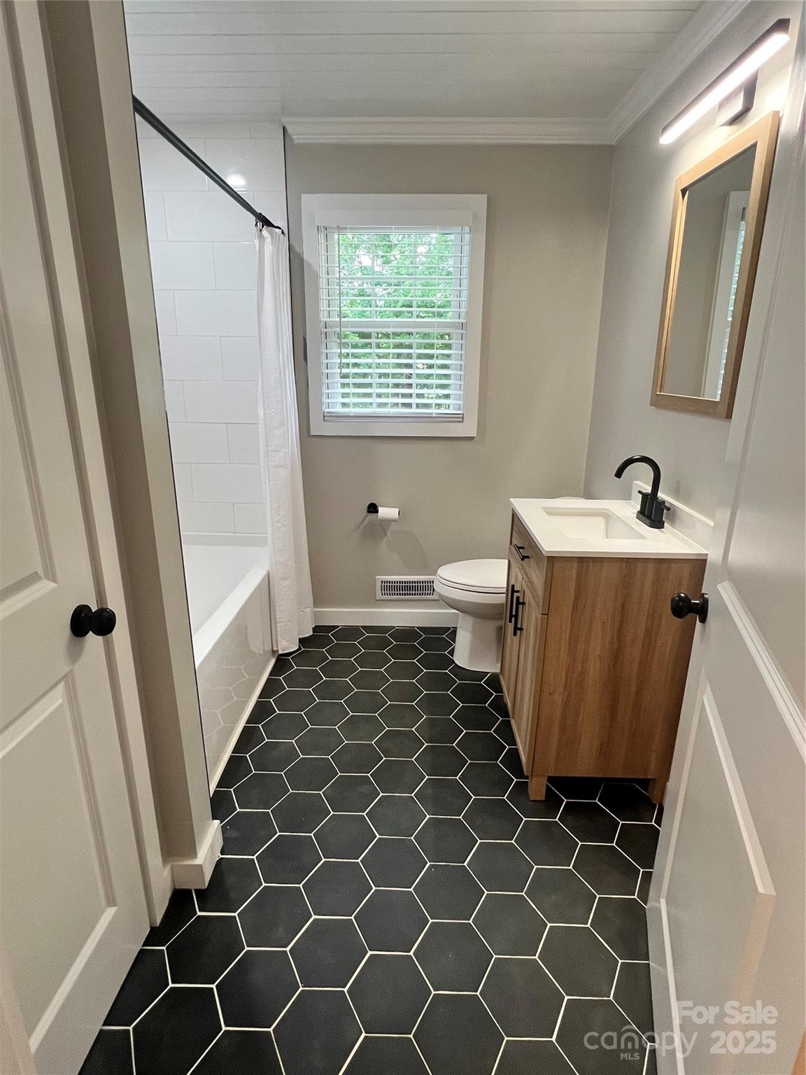800 Charles Road Shelby, NC 28152 - Photo 13 of 21 a bathroom with a sink and a mirror