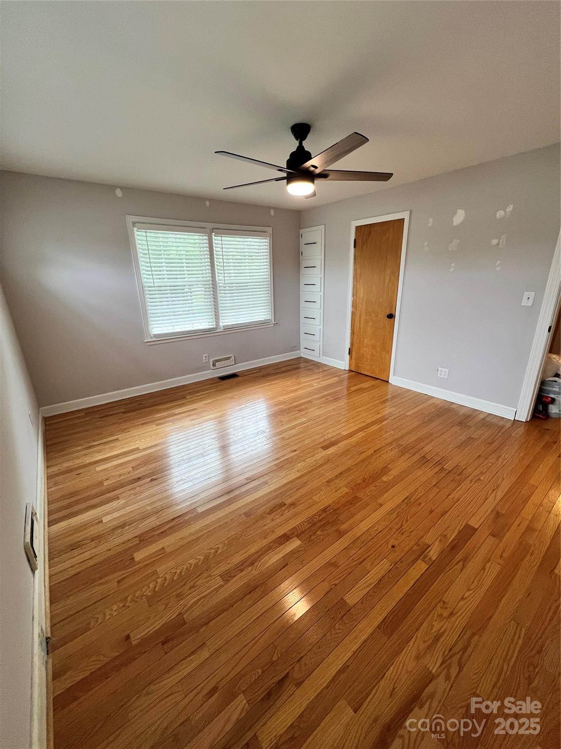 800 Charles Road Shelby, NC 28152 - Photo 16 of 21 wooden floor in an empty room with a window