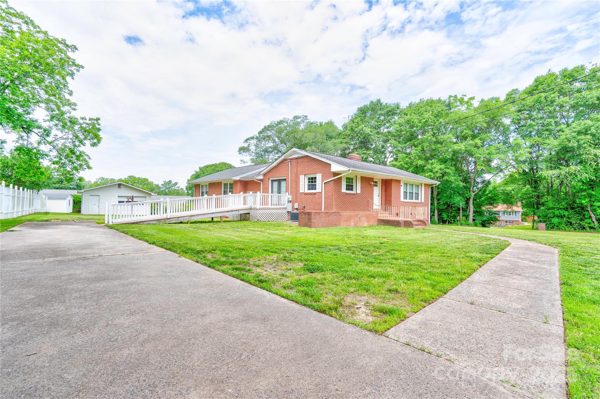 800 Charles Road Shelby, NC 28152 - Photo 2 of 21 a house with green field in front of it