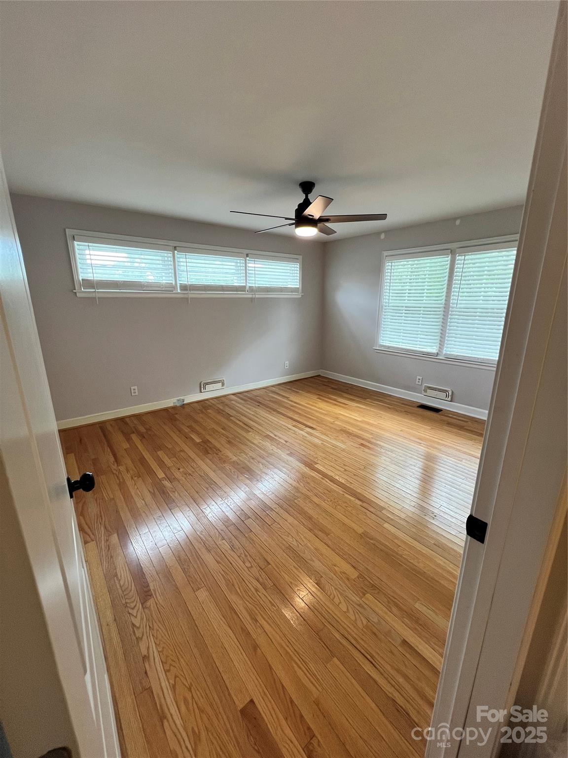 800 Charles Road Shelby, NC 28152 - Photo 21 of 21 a view of empty room with wooden floor and fan