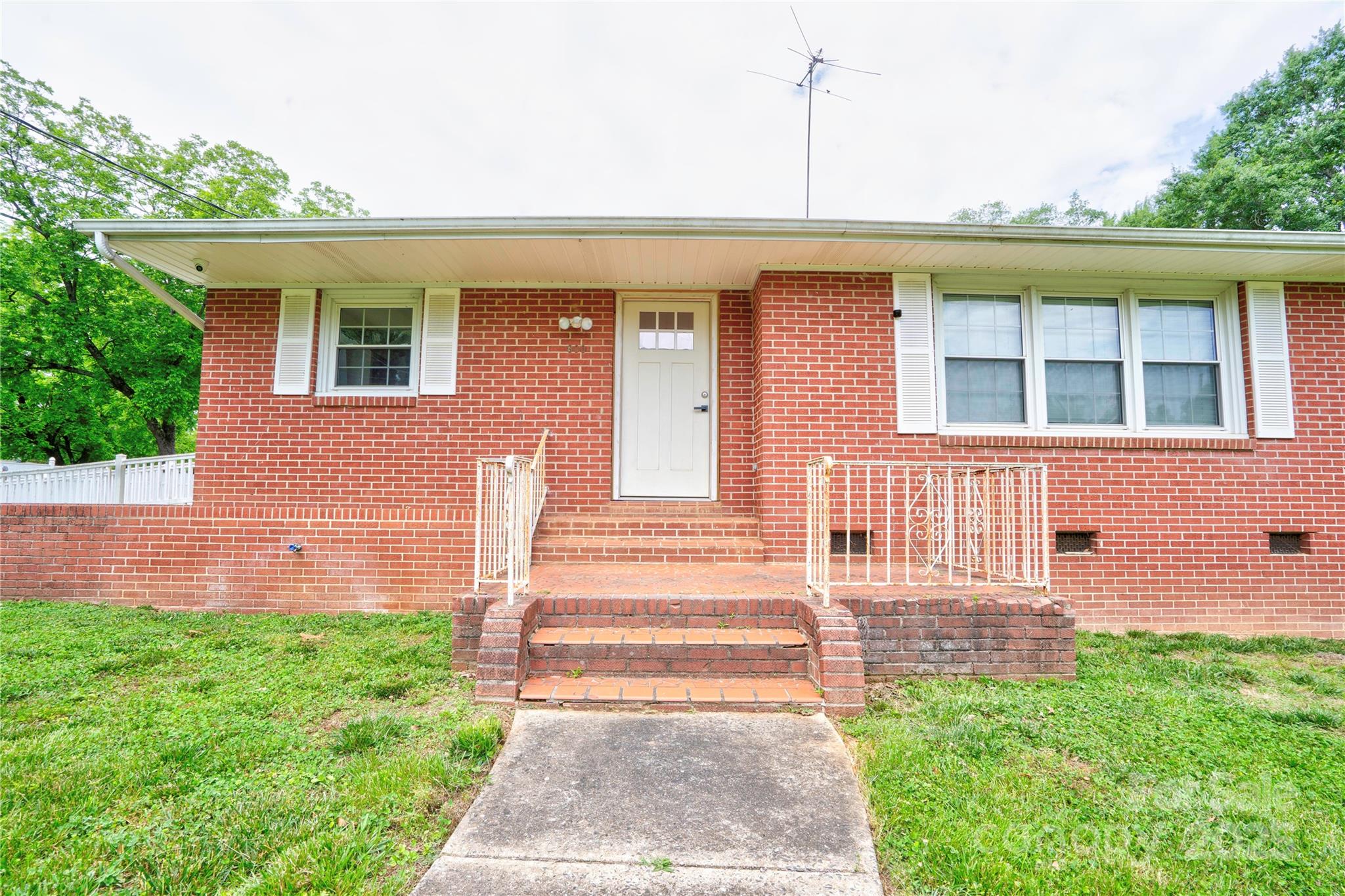 800 Charles Road Shelby, NC 28152 - Photo 5 of 21 a front view of a house with a yard