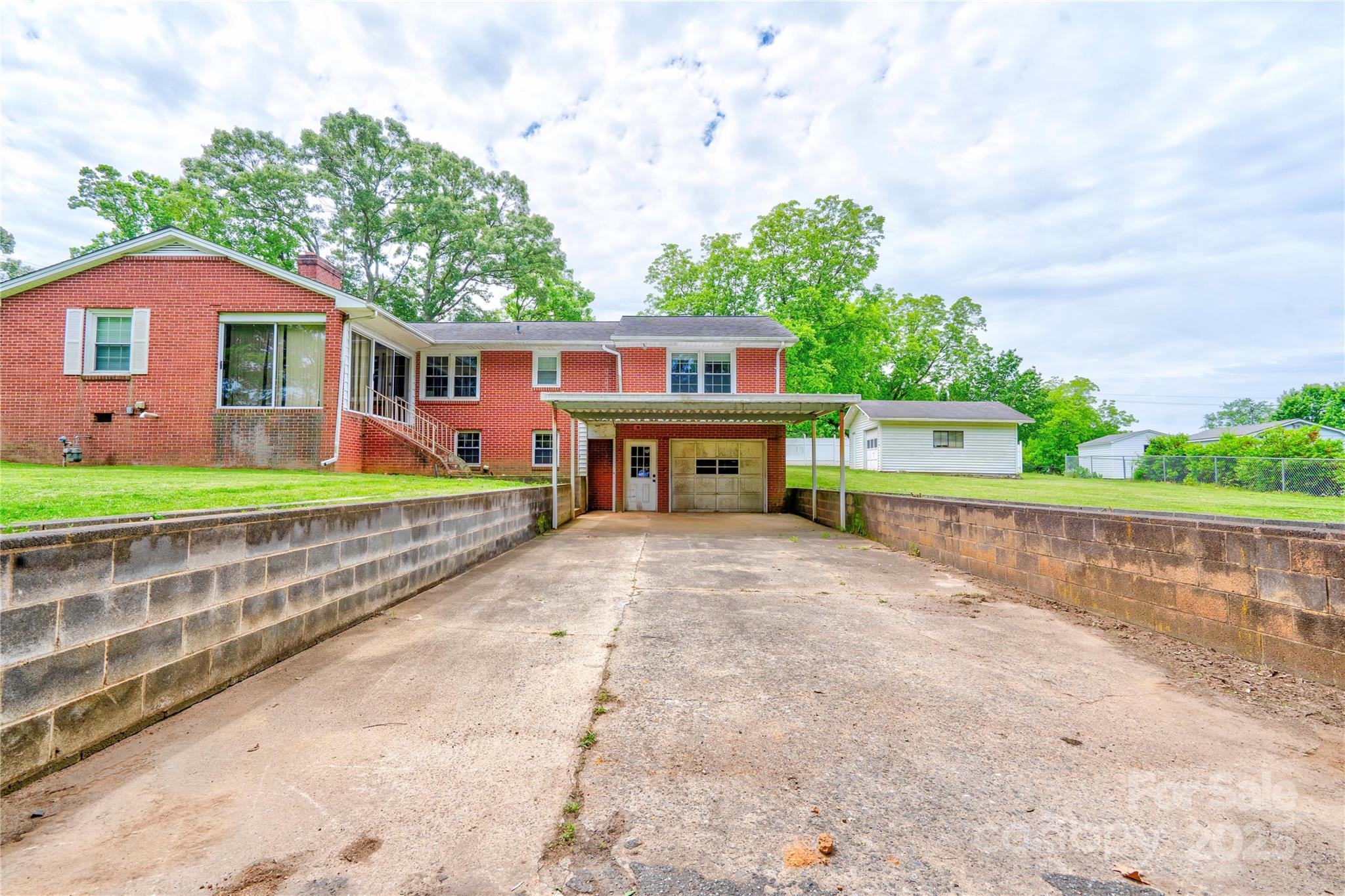 800 Charles Road Shelby, NC 28152 - Photo 6 of 21 a front view of a house with a yard and garage